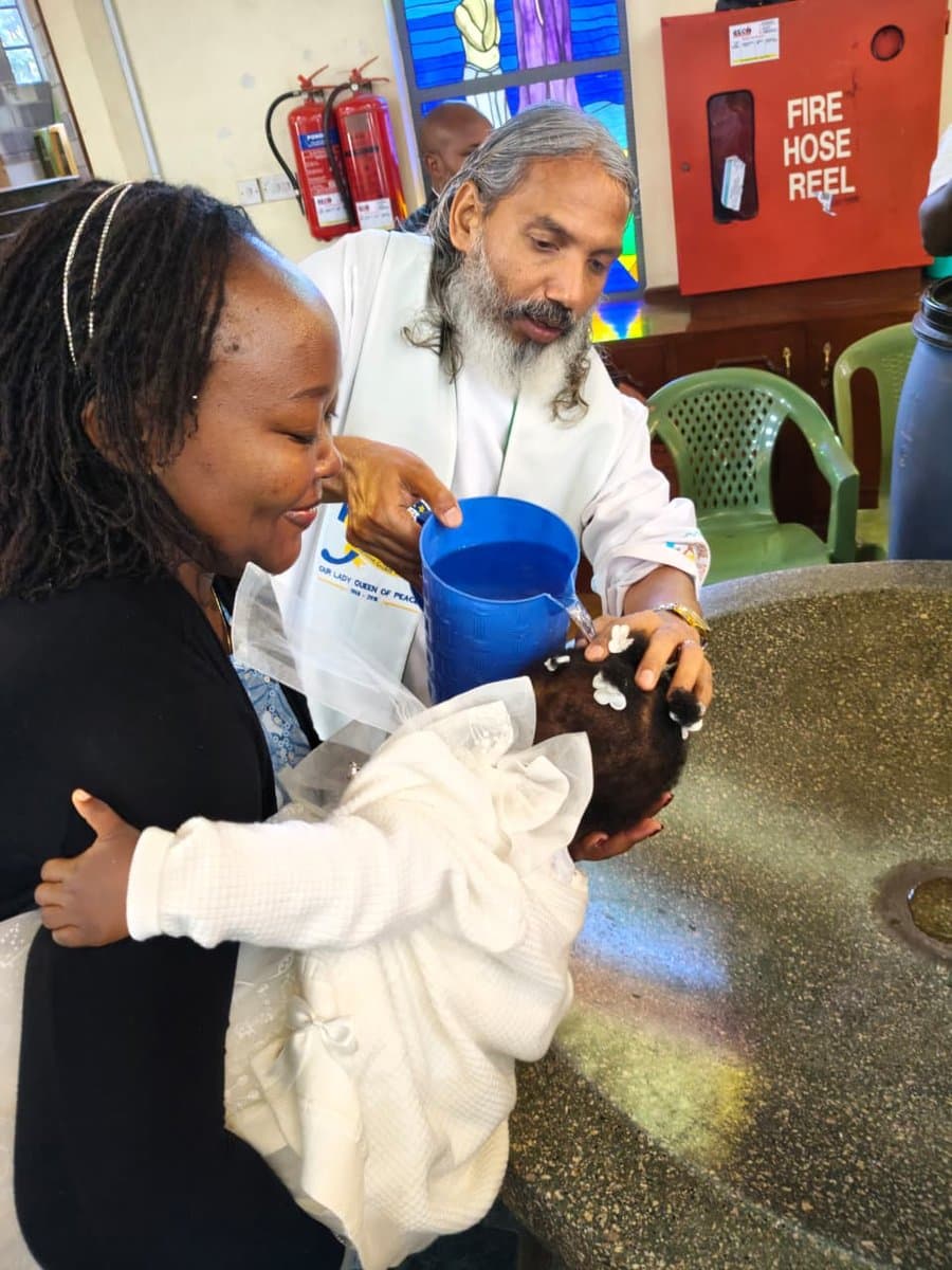 An infant baptism at Our Lady Queen of Peace Parish